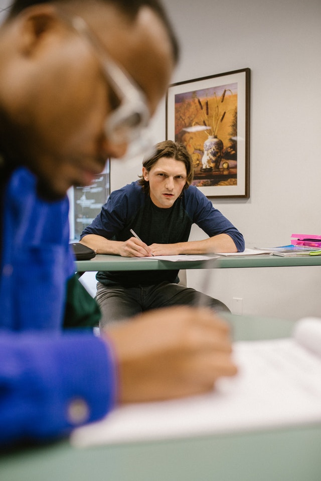 A student copying the work of another student