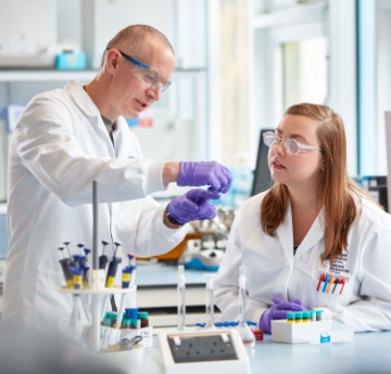 2 people at a laboratory table