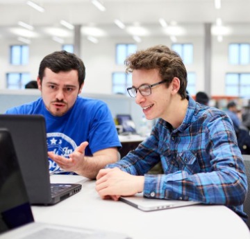 2 Students sat at computer