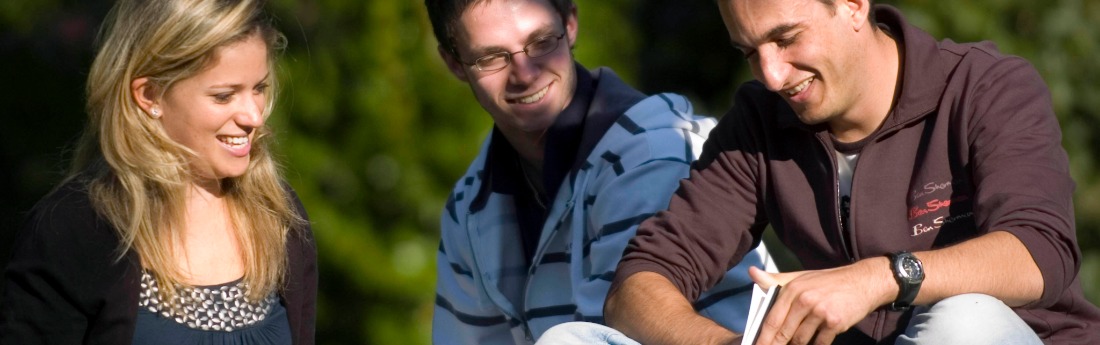 three students studying in Singleton park