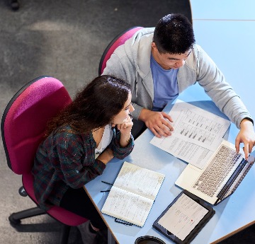 two people looking at laptop