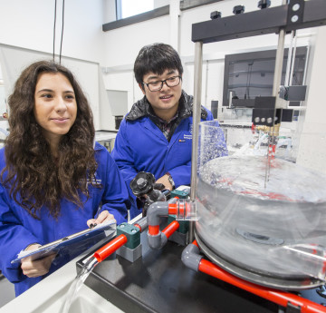 Female and male student in science laboratory