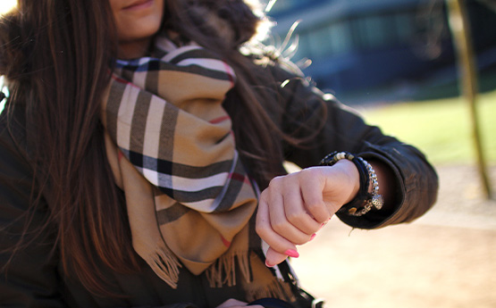 A woman looking at her watch