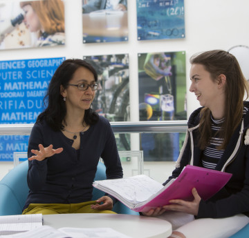 Staff and student member having a discussion