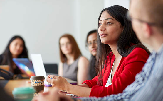 female talking in meeting