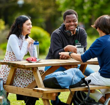 students studying at a bench