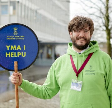 Student Ambassador Holding a Lollipop