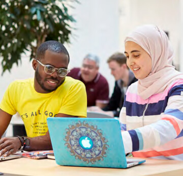 students looking at laptop