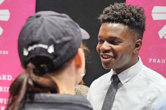 Image of an employer talking to a student at the careers fair 