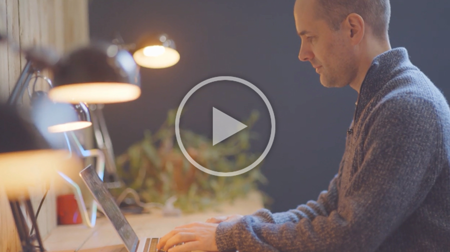 dr ben reynolds from the urban foundry sitting at a desk on his laptop