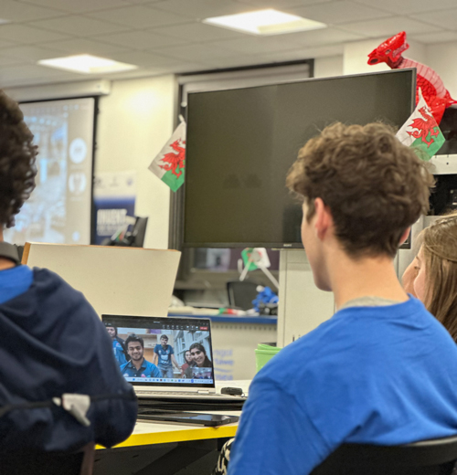 students looking at computer on a zoom call