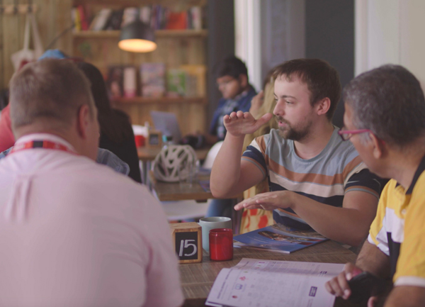 students at table talking 