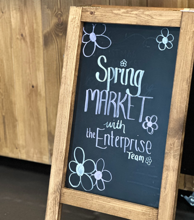 wooden sign with writing on