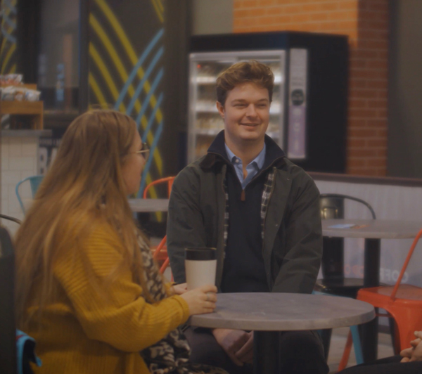 people meeting having a coffee and smiling