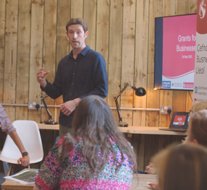 staff member giving lecture to students