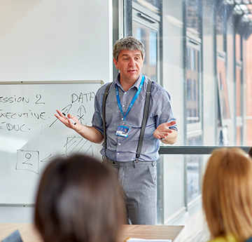 Male lecturer delivering a class