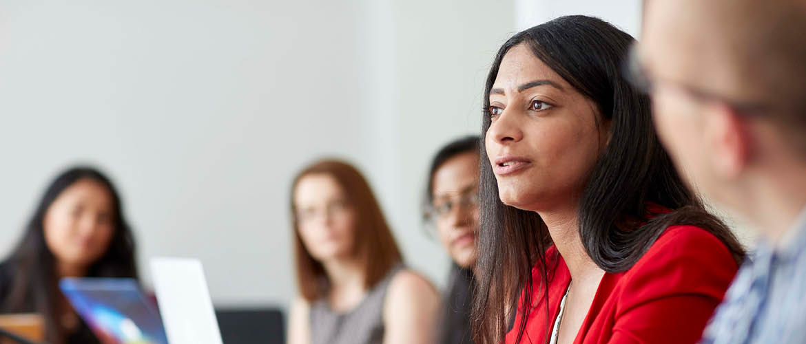 female speaking at a meeting