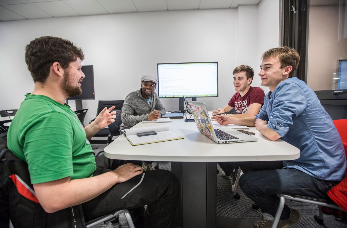 Students sitting around computer