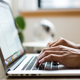 Person typing on laptop