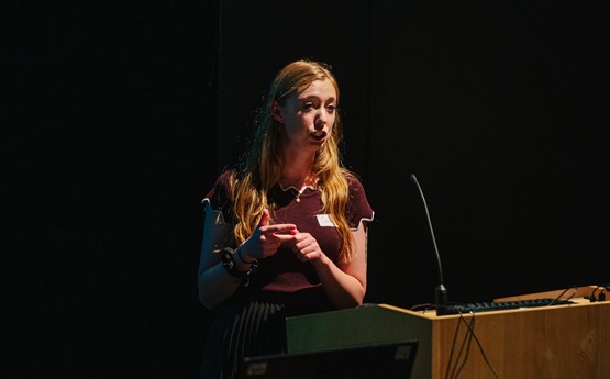 Woman speaking on stage