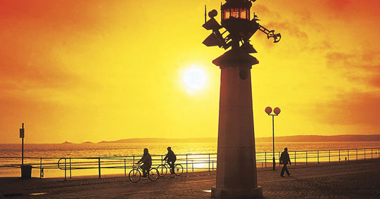 Bright yellow and orange sunset over Swansea Bay, taken from Swansea Marina