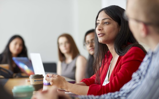 Staff sitting around a conference table during a meeting