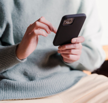 Person browsing on a mobile phone