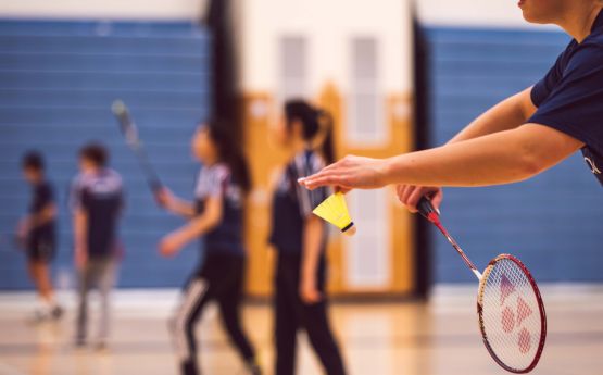 Student playing badminton