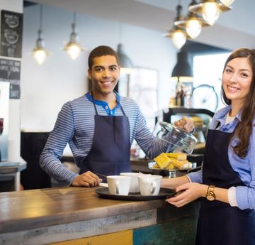 Two students working in cafe